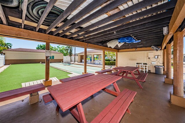 3838 Lanyard Ct Unit B, New Port Richey, FL 34652 - view of patio / terrace with shuffleboard
