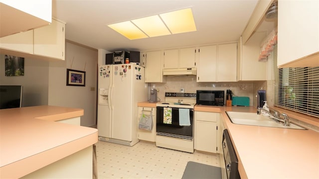5309 Bayonne Ave, Spring Hill, FL 34608 - kitchen featuring black appliances, under cabinet range hood, a sink, light countertops, and backsplash