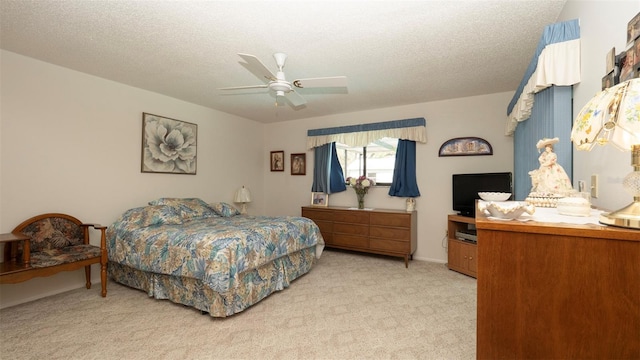 5309 Bayonne Ave, Spring Hill, FL 34608 - bedroom with light carpet, a textured ceiling, and ceiling fan