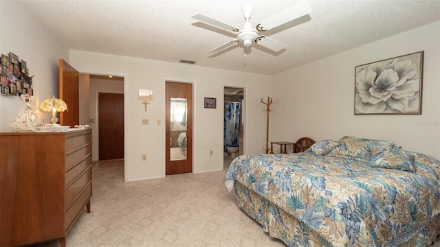 5309 Bayonne Ave, Spring Hill, FL 34608 - bedroom featuring light colored carpet, a walk in closet, a textured ceiling, a ceiling fan, and a closet