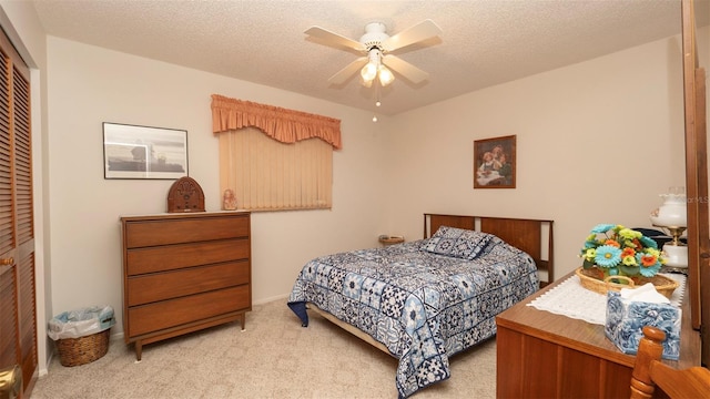 5309 Bayonne Ave, Spring Hill, FL 34608 - carpeted bedroom with a closet, a textured ceiling, and a ceiling fan