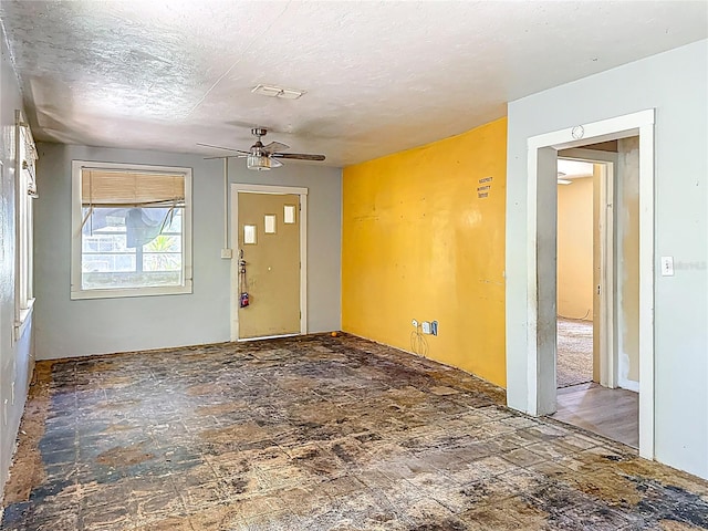1324 SE 4th Ave, Gainesville, FL 32641 - foyer with ceiling fan, a textured ceiling, and stone finish flooring