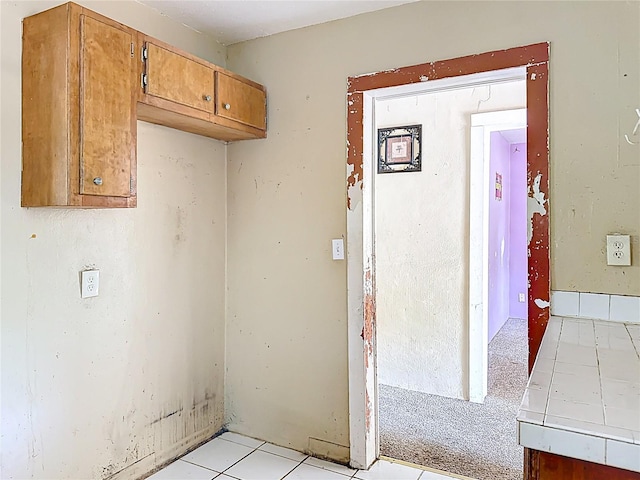 1324 SE 4th Ave, Gainesville, FL 32641 - laundry room featuring light tile patterned floors