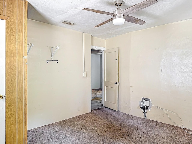 1324 SE 4th Ave, Gainesville, FL 32641 - unfurnished room with carpet floors, ceiling fan, and a textured ceiling