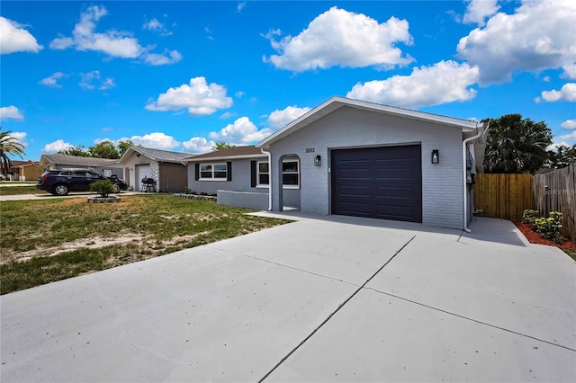6306 Aberdeen Ave, New Port Richey, FL 34653 - single story home with an attached garage, concrete driveway, and brick siding
