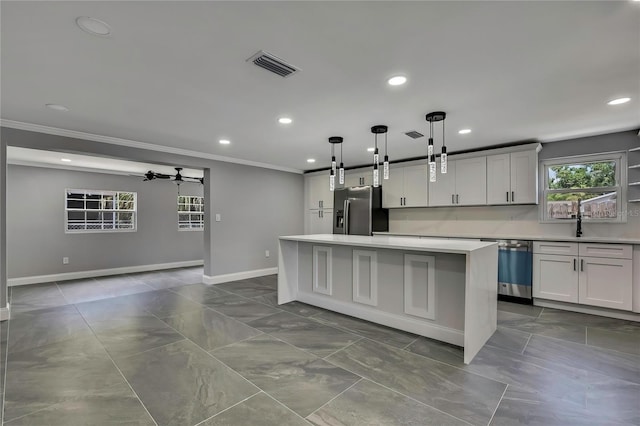 6306 Aberdeen Ave, New Port Richey, FL 34653 - kitchen featuring fridge with ice dispenser, crown molding, a kitchen island, stainless steel dishwasher, and a barn door