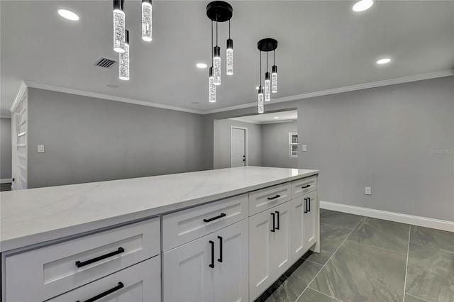 6306 Aberdeen Ave, New Port Richey, FL 34653 - kitchen with ornamental molding, dark marble finish floors, hanging light fixtures, white cabinetry, and recessed lighting