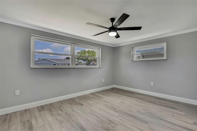 6306 Aberdeen Ave, New Port Richey, FL 34653 - spare room featuring crown molding, healthy amount of natural light, wood finished floors, and baseboards