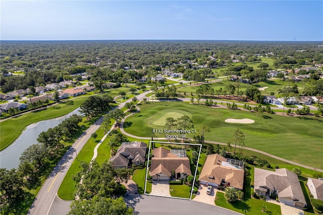 8132 Summersong Ct, Spring Hill, FL 34606 - aerial view of residential area with property boundaries highlighted, a golf club, and a large body of water