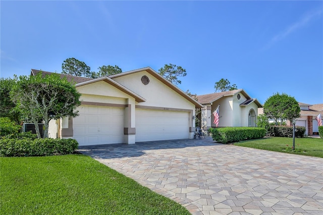8132 Summersong Ct, Spring Hill, FL 34606 - single story home featuring stucco siding, decorative driveway, an attached garage, and a front yard