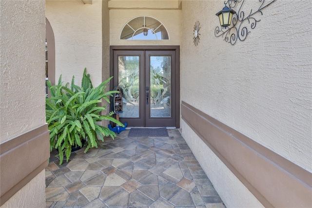 8132 Summersong Ct, Spring Hill, FL 34606 - doorway to property featuring french doors and stucco siding