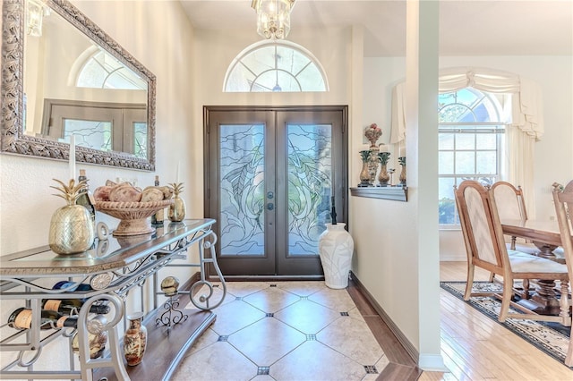 8132 Summersong Ct, Spring Hill, FL 34606 - foyer featuring french doors, healthy amount of natural light, and baseboards