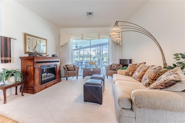 8132 Summersong Ct, Spring Hill, FL 34606 - living area with carpet and a glass covered fireplace
