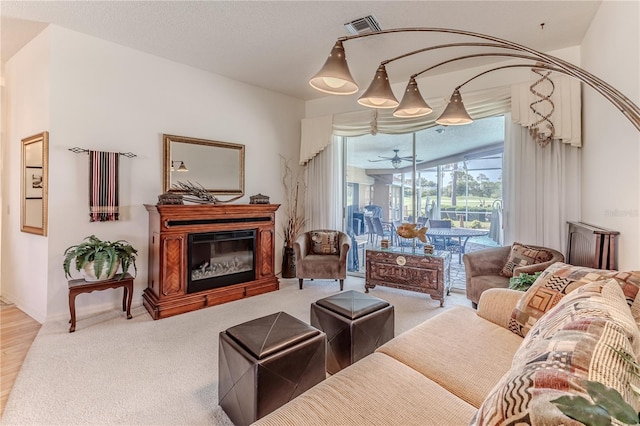 8132 Summersong Ct, Spring Hill, FL 34606 - living area featuring a glass covered fireplace and carpet floors