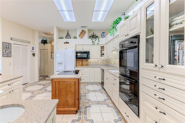 8132 Summersong Ct, Spring Hill, FL 34606 - kitchen with black appliances, glass insert cabinets, white cabinets, and light tile patterned flooring