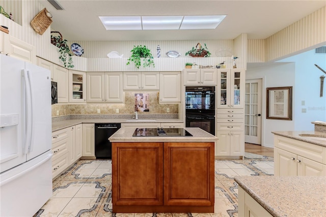 8132 Summersong Ct, Spring Hill, FL 34606 - kitchen with black appliances, light tile patterned flooring, a sink, and glass insert cabinets