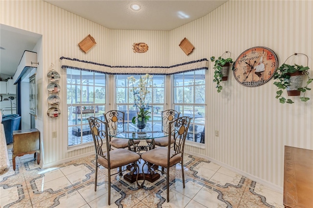 8132 Summersong Ct, Spring Hill, FL 34606 - dining space with wallpapered walls, baseboards, and light tile patterned floors