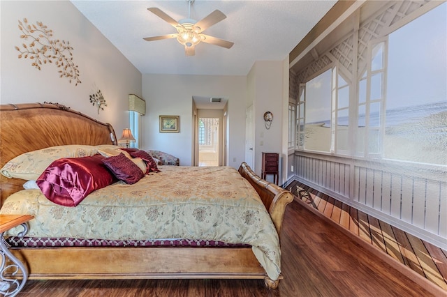 8132 Summersong Ct, Spring Hill, FL 34606 - bedroom with wood finished floors and a ceiling fan