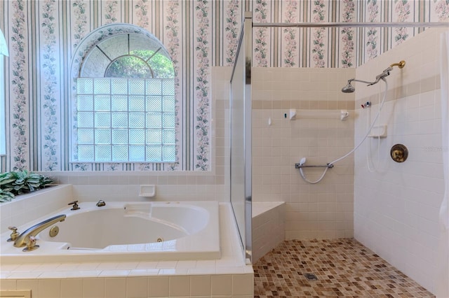 8132 Summersong Ct, Spring Hill, FL 34606 - full bath with a stall shower, a whirlpool tub, healthy amount of natural light, and wallpapered walls