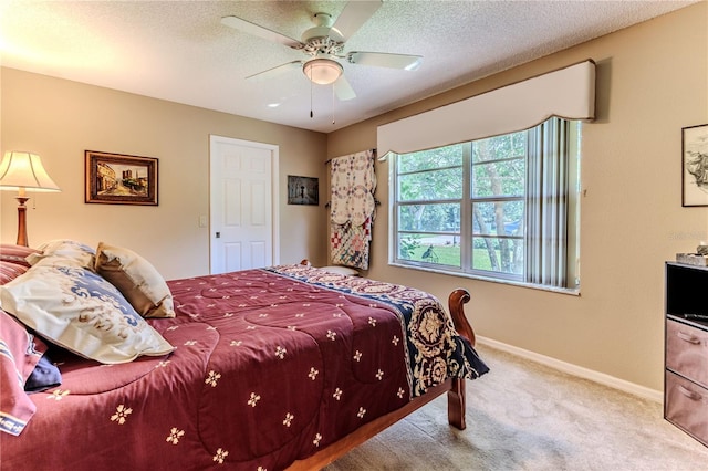 8132 Summersong Ct, Spring Hill, FL 34606 - carpeted bedroom featuring baseboards, a ceiling fan, and a textured ceiling
