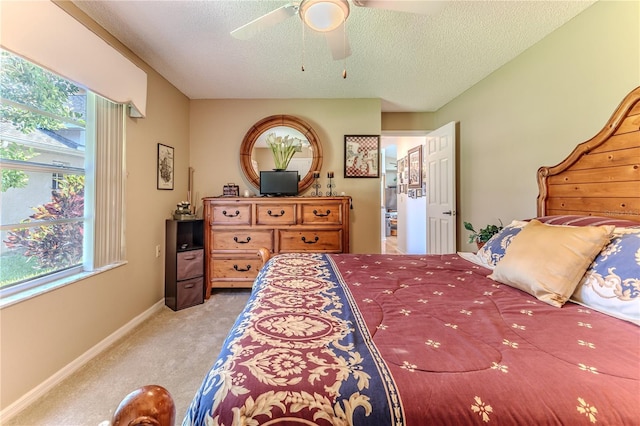 8132 Summersong Ct, Spring Hill, FL 34606 - bedroom with light carpet, multiple windows, a textured ceiling, baseboards, and ceiling fan