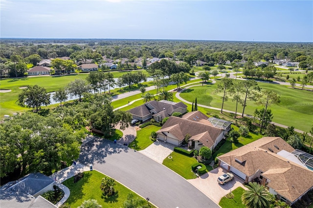 8132 Summersong Ct, Spring Hill, FL 34606 - aerial perspective of suburban area featuring a local golf course and a nearby body of water