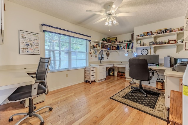 8132 Summersong Ct, Spring Hill, FL 34606 - office space with a ceiling fan, a textured ceiling, light wood-type flooring, and baseboards