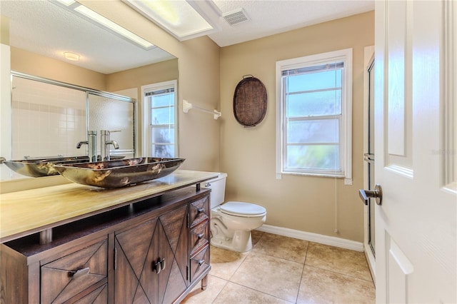 8132 Summersong Ct, Spring Hill, FL 34606 - full bath featuring vanity, healthy amount of natural light, tile patterned floors, and toilet