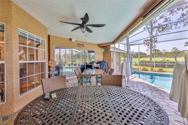 8132 Summersong Ct, Spring Hill, FL 34606 - sunroom with ceiling fan and outdoor dining space