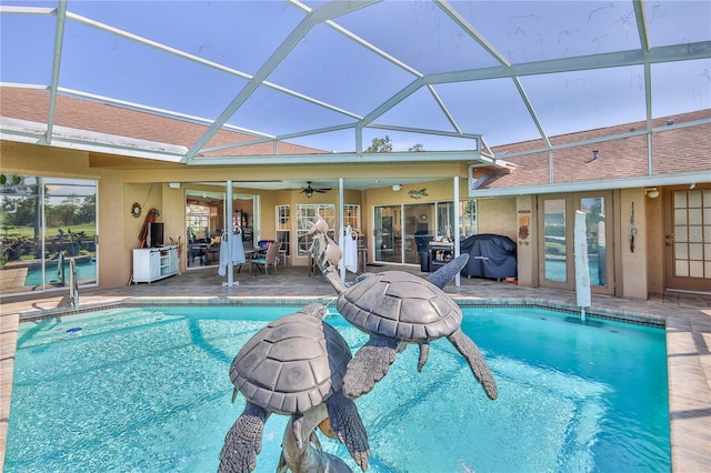 8132 Summersong Ct, Spring Hill, FL 34606 - outdoor pool featuring ceiling fan, a patio, and glass enclosure