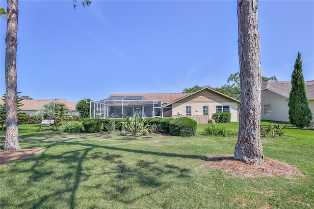 8132 Summersong Ct, Spring Hill, FL 34606 - back of property featuring a yard and glass enclosure