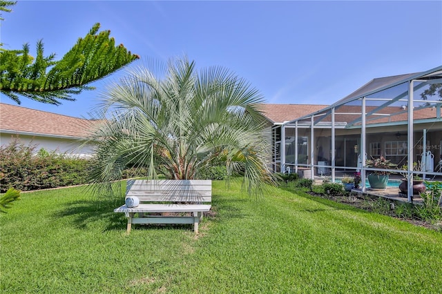8132 Summersong Ct, Spring Hill, FL 34606 - view of green lawn with an outdoor pool and glass enclosure