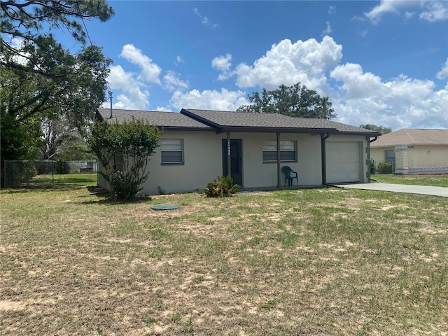 11392 Beechdale Ave, Spring Hill, FL 34608 - view of front of house with a garage, stucco siding, and driveway