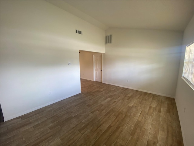 11392 Beechdale Ave, Spring Hill, FL 34608 - unfurnished room featuring dark wood-style flooring, high vaulted ceiling, and baseboards