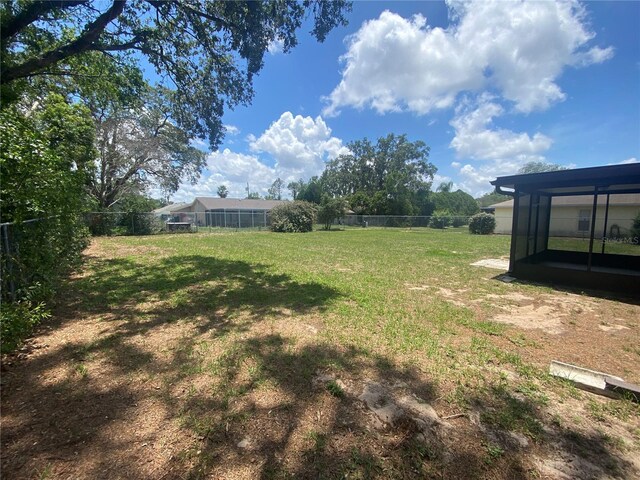 11392 Beechdale Ave, Spring Hill, FL 34608 - view of yard featuring a sunroom