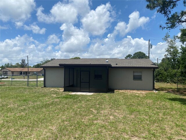 11392 Beechdale Ave, Spring Hill, FL 34608 - rear view of house featuring a sunroom and stucco siding