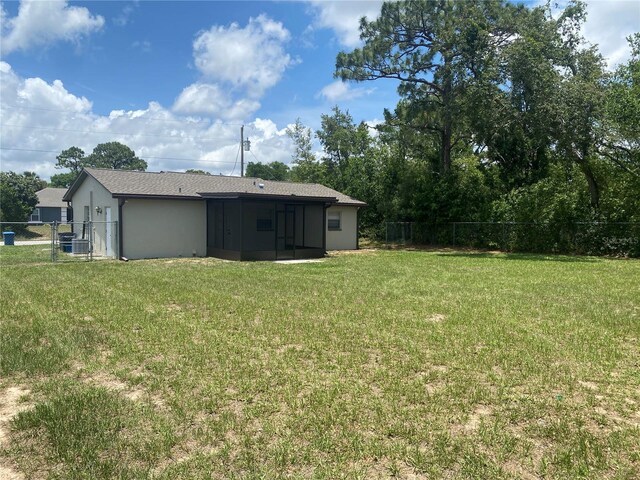 11392 Beechdale Ave, Spring Hill, FL 34608 - view of yard featuring a sunroom