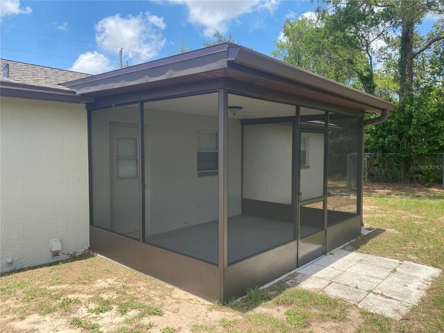 11392 Beechdale Ave, Spring Hill, FL 34608 - view of patio featuring a sunroom