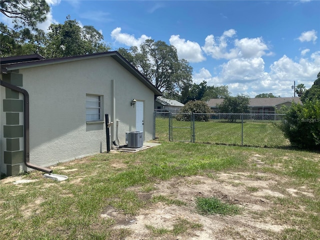 11392 Beechdale Ave, Spring Hill, FL 34608 - view of yard with central air condition unit and a gate