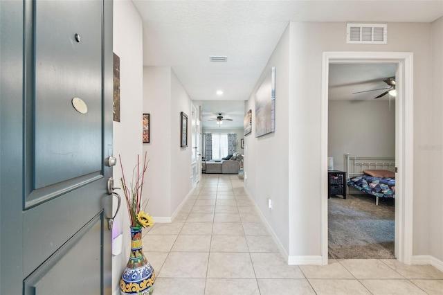 3886 Reflection Dock Dr, Seffner, FL 33584 - hall featuring light tile patterned floors and baseboards