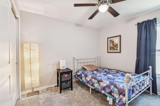 3886 Reflection Dock Dr, Seffner, FL 33584 - carpeted bedroom with ceiling fan and baseboards