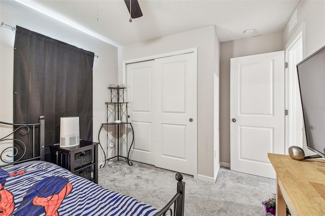 3886 Reflection Dock Dr, Seffner, FL 33584 - carpeted bedroom with a closet, baseboards, and a ceiling fan