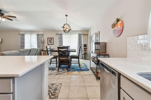 3886 Reflection Dock Dr, Seffner, FL 33584 - kitchen with dishwasher, light tile patterned floors, open floor plan, decorative backsplash, and ceiling fan