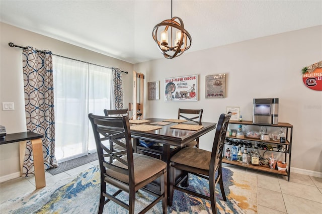 3886 Reflection Dock Dr, Seffner, FL 33584 - dining area with tile patterned floors, a chandelier, and baseboards