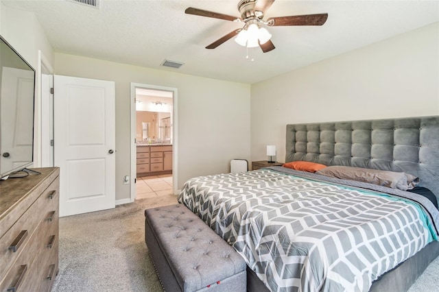 3886 Reflection Dock Dr, Seffner, FL 33584 - bedroom featuring light colored carpet, ensuite bath, and ceiling fan