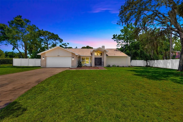 11291 Countrywood Ct, Spring Hill, FL 34609 - view of front of house featuring a garage, concrete driveway, and a chimney