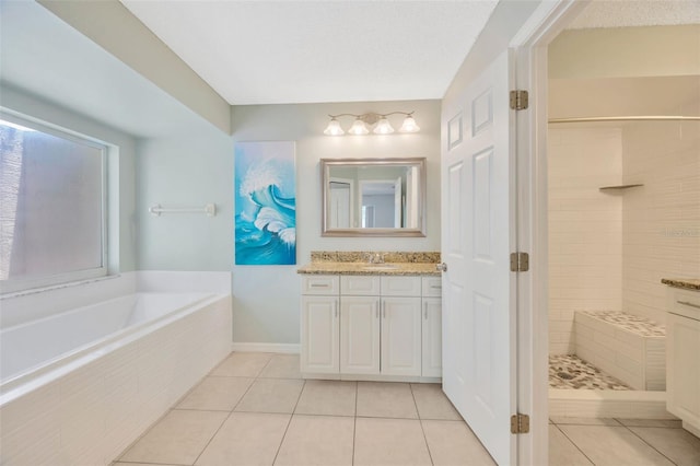 11291 Countrywood Ct, Spring Hill, FL 34609 - full bathroom featuring vanity, tile patterned flooring, a bath, and tiled shower