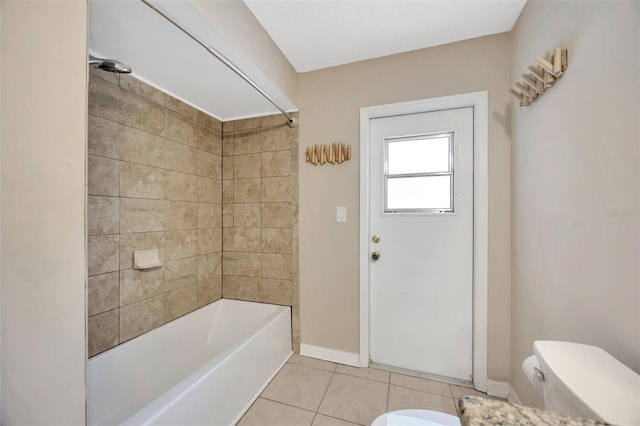 11291 Countrywood Ct, Spring Hill, FL 34609 - bathroom with toilet, tile patterned flooring, shower / bath combination, and baseboards