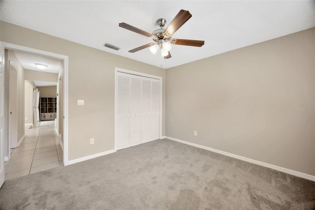 11291 Countrywood Ct, Spring Hill, FL 34609 - unfurnished bedroom with light carpet, a closet, and baseboards