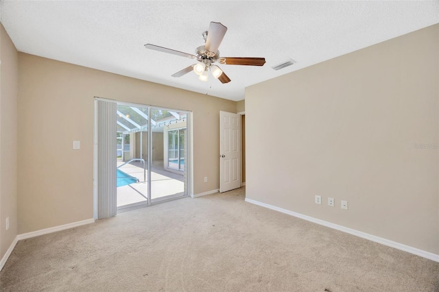 11291 Countrywood Ct, Spring Hill, FL 34609 - carpeted spare room with a ceiling fan and baseboards